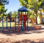 Thumbnail 4 of 16 - Multi Colored Playground in Shaded Courtyard with Tall Trees