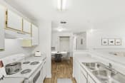 Thumbnail 9 of 35 - a kitchen and dining area in a 555 waverly unit