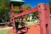 Thumbnail 10 of 11 - Outdoor Playground equipped with a slide, monkey bars, and ladder
