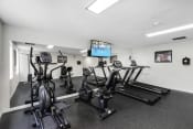 Thumbnail 16 of 19 - Fitness Facilities with mirrored wall at Willows Court Apartment Homes, Seattle, WA