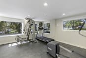 Thumbnail 5 of 27 - Fitness Facilities with a Treadmill, Weights, and Oversized Windows for an Abundance of Light  at Sir Gallahad Apartment Homes, Bellevue, WA
