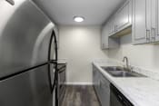 Thumbnail 13 of 30 - interior kitchen with stainless steel appliances at Swiss Gables Apartment Homes, Kent