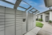 Thumbnail 30 of 39 - a pergola with a dog kennel attached to the side of a house at Highland Luxury Living Apartments, Lewisville