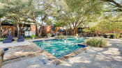 Thumbnail 14 of 29 - Pool With Sunning Deck at Indian Creek Apartments, Carrollton, 75007