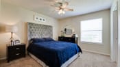 Thumbnail 12 of 30 - Bedroom With Ceiling Fan at Woodland Hills, Irving, TX, 75062