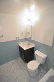 Thumbnail 14 of 15 - a bathroom with a toilet sink and bathtub