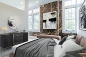 Thumbnail 5 of 11 - a bedroom with a bed and a brick wall
