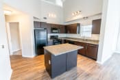 Thumbnail 18 of 21 - a kitchen with black appliances and granite counter tops