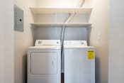 Thumbnail 30 of 40 - a washer and dryer in a laundry room