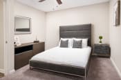 Thumbnail 13 of 20 - Bedroom with Grey Bed at Arbor Park Apartments, Jackson, MS, 39209