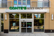 Thumbnail 34 of 44 - the front of a converse bike shop with a sign above the door