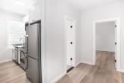 Thumbnail 6 of 23 - a renovated kitchen with stainless steel appliances in a new home