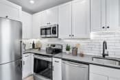 Thumbnail 7 of 31 - Stainless Steel Appliances, Quartz Counters & Custom Cabinetry