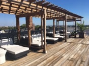 Thumbnail 3 of 44 - a rooftop deck with lounge chairs and a pergola