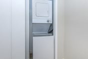 Thumbnail 8 of 17 - a small refrigerator with a washer and dryer