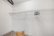 Thumbnail 24 of 37 - the living room of a studio apartment with white walls and a white closet with a