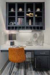 Thumbnail 5 of 26 - a small desk with a chair and a black cabinet