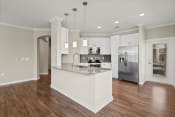 Thumbnail 3 of 25 - a kitchen with white cabinetry and stainless steel appliances