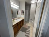 Thumbnail 2 of 21 - a bathroom with a sink and a mirror