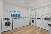 Thumbnail 22 of 24 - the preserve at ballantyne commons laundry room with washes and dryers