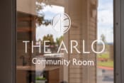 Thumbnail 33 of 39 - the arlo community room logo on a glass door