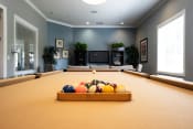 Thumbnail 17 of 28 - a game room with a pool table and