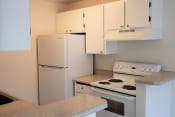 Thumbnail 1 of 7 - Apartments for Rent in Des Moines - Marina Club - Kitchen with White Appliances, Spacious Countertops, and White Cabinets