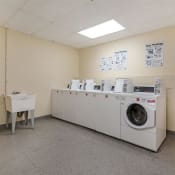 Thumbnail 13 of 15 - Laundry facility with washers and dryers