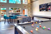 Thumbnail 29 of 38 - Clock Tower Village game room with pool table