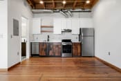 Thumbnail 30 of 81 - a kitchen with white cabinets and stainless steel appliances