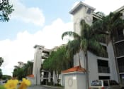 Thumbnail 5 of 13 - Exterior of building with trees Heron Pointe Apartments Miramar Florida