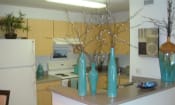 Thumbnail 9 of 13 - Mariners cove apartment home kitchen space with white appliances and blonde colored cabinetry