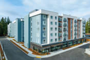 Thumbnail 1 of 22 - Shoreline Apartments - Quinn by Vintage - Exterior of Building CGI Generated with Manicured Lawn, Street Access, and Trees