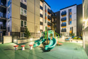 Thumbnail 5 of 14 - Open courtyard with playground - well lit.