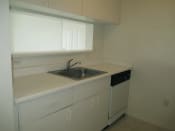 Thumbnail 9 of 18 - Siesta Pointe apartment home kitchen with white appliances and white cabinetry