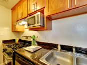 Thumbnail 15 of 26 - The Post Apartments kitchen area with double sinks
