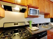 Thumbnail 14 of 26 - The Post Apartments kitchen area with stainless steel appliances
