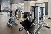 Thumbnail 17 of 27 - fitness center with strength training equipment