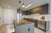 Thumbnail 7 of 29 - 3thirty3 new rochelle ny apartment high rise photo of kitchen with modern furnishings