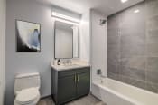 Thumbnail 5 of 29 - 3thirty3 new rochelle ny apartment high rise photo of bathroom with vanity and tub shower
