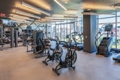 Thumbnail 16 of 29 - 3thirty3 new rochelle ny apartment high rise photo of large fitness center with cardio and strength training equipment such as exercise bicycles and weight machines