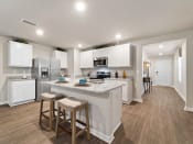 Thumbnail 2 of 20 - Gourmet Kitchen With Island at The Village at Hickory Street, Foley, AL