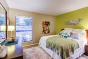 Thumbnail 21 of 35 - a bedroom with green walls and a large window
