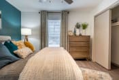 Thumbnail 7 of 20 - The Jaunt Apartments in Charleston South Carolina photo of bedroom with plush carpeting and a ceiling fan