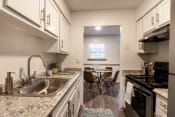 Thumbnail 5 of 20 - The Jaunt Apartments in Charleston South Carolina photo of kitchen with white cabinets