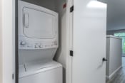 Thumbnail 34 of 45 - a washer and dryer in a laundry room