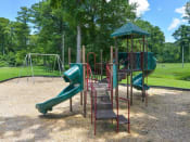 Thumbnail 3 of 16 - Outdoor playground at Forest Hills apartments