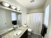 Thumbnail 8 of 27 - Granite Countertop Upgrade in a Large Bathroom at Bloomfield Townhomes
