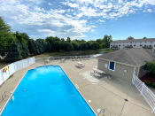 Thumbnail 21 of 27 - Swimming pool at Bloomfield Townhomes in Kentwood MI
