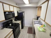 Thumbnail 5 of 28 - fully-equipped kitchen at berkshire apartments and townhomes